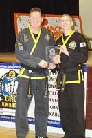 mark lloyd receiving choi kwang do award from Derek Bicknell